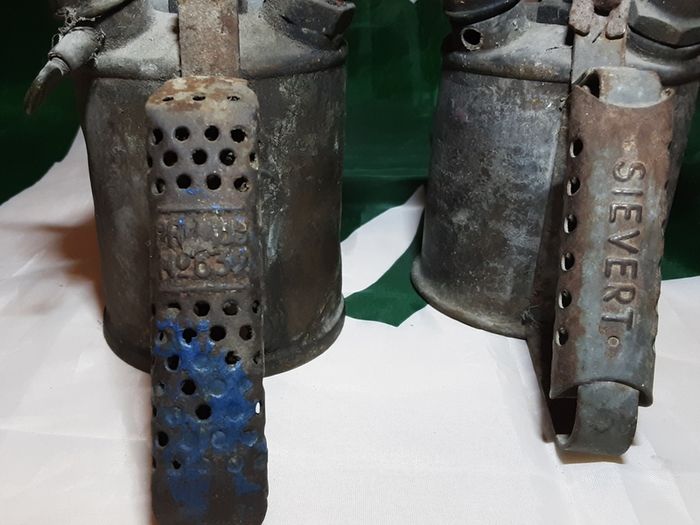 three vintage brass torches,