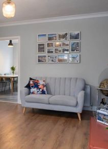 Two seater Eazy Living grey sofa