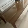 Brown wooden dining table with glass top Image 3