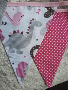 Dinosaur buntings . Blue and pink