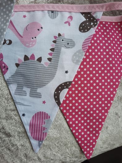 Dinosaur buntings . Blue and pink