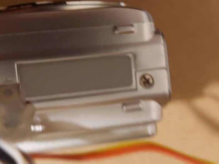 Z880 Digital Camera, Takes 2AA Batteries, working fine, has a modification that doesn't affect its performance