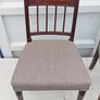 Two vintage mahogany dining chair with a pediment-style top rail, turned spindle back and turned front legs seat in a textured gray fabric Image 2