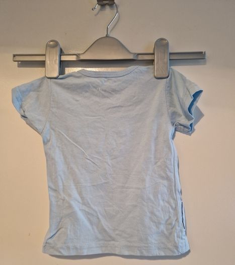 A selection of brand new baby clothes and items