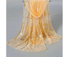 Pretty Apricot Scarf with a golden print