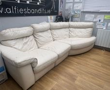 Cream leather sofa with electric recliner end