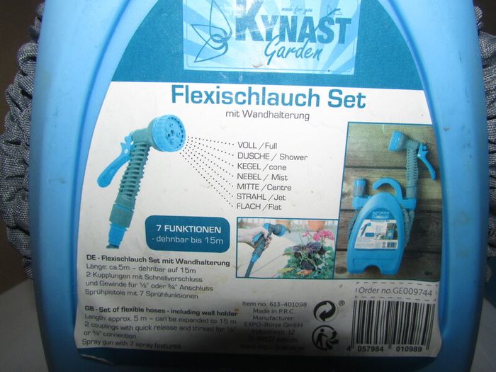 Flexible hose including wall holder