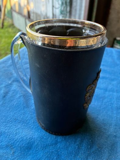 Vintage pint glass in leather holder