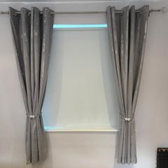 2 pairs crushed velvet eyelet curtains.