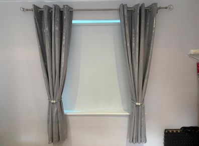 2 pairs crushed velvet eyelet curtains.