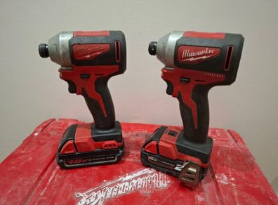 2 Milwaukee impact drivers with batteries