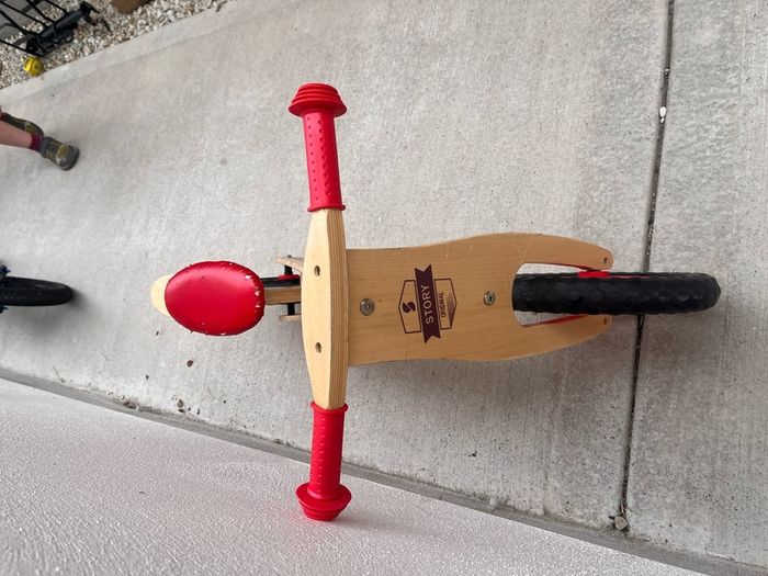 Story wooden balance bike
