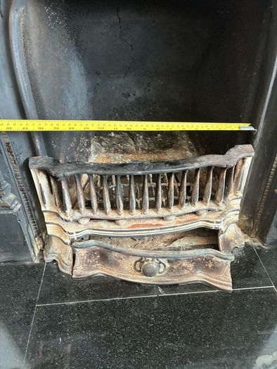 Beautiful ornate fire surround, cast Iron. Granite hearth and fire front. Very good condition