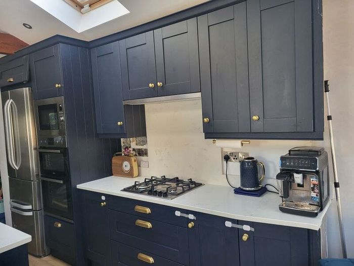 Kitchen units, island and quartz worktops.