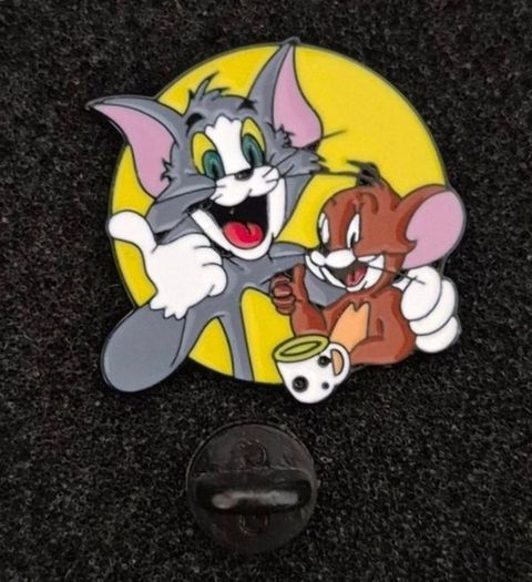 Tom and jerry , pin back badge.