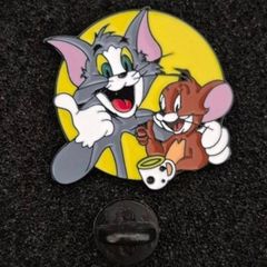 Tom and jerry , pin back badge.