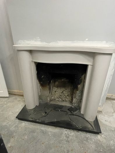 Victorian-style cast iron fireplace insert, surround and hearth