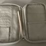 travel organizer wallet in purple with multiple card slots and mesh pockets Image 2