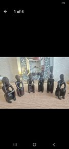 Set of 6 Vintage African Hand-Carved "Thinker" Figurines An excellent matching collection of vintage African "Thinking Man" sculptures. Each individual piece is uniquely hand-carved out of a single block of dark hardwood with a lovely smooth, polished fin
