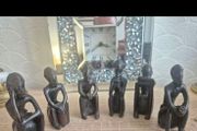Set of 6 Vintage African Hand-Carved "Thinker" Figurines An excellent matching collection of vintage African "Thinking Man" sculptures. Each individual piece is uniquely hand-carved out of a single block of dark hardwood with a lovely smooth, polished fin