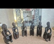 Set of 6 Vintage African Hand-Carved "Thinker" Figurines An excellent matching collection of vintage African "Thinking Man" sculptures. Each individual piece is uniquely hand-carved out of a single block of dark hardwood with a lovely smooth, polished fin