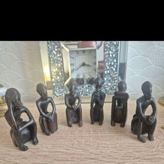 Set of 6 Vintage African Hand-Carved "Thinker" Figurines An excellent matching collection of vintage African "Thinking Man" sculptures. Each individual piece is uniquely hand-carved out of a single block of dark hardwood with a lovely smooth, polished fin