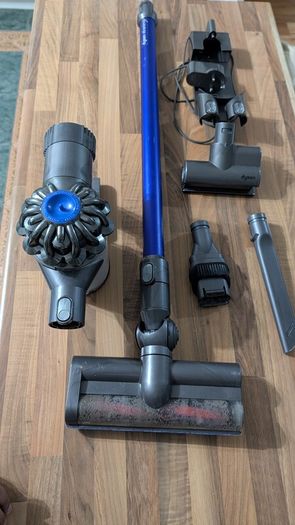 Dyson V6 handheld vacuum cleaner with charger and accessories