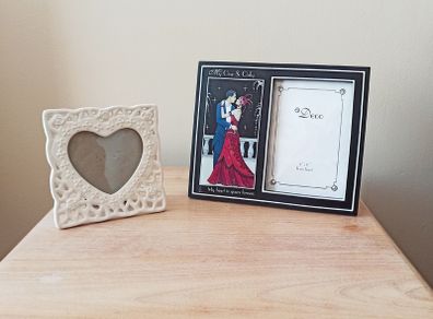 Two freestanding glazed photo frames;  white ceramic heart-shaped picture frame &  Art Deco style dual picture frame