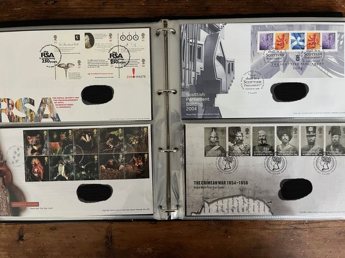 Collection of  87 UK First Day Cover stamps 2003 to 2006 in album