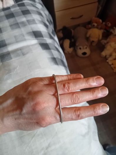 Silver toned bracelet with a heart shaped charm