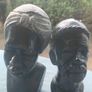 2x Tribal carved stone heads Image 2