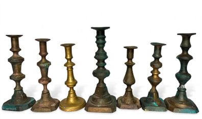 7 antique brass candle holders