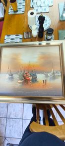 Framed Oil Painting on canvas of sailboats at sunset signed..