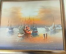 Framed Oil Painting on canvas of sailboats at sunset signed..