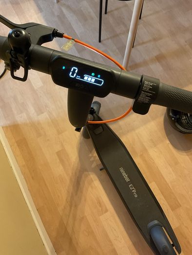 Ninebot E2 scooter with a helmet