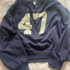 Navy sports jumper with number