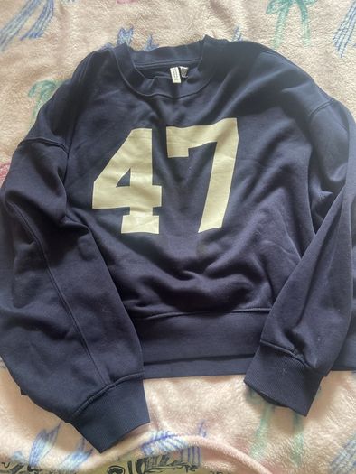 Navy sports jumper with number