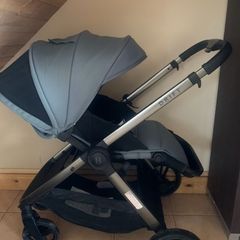 Sage green buggie with rain cover.