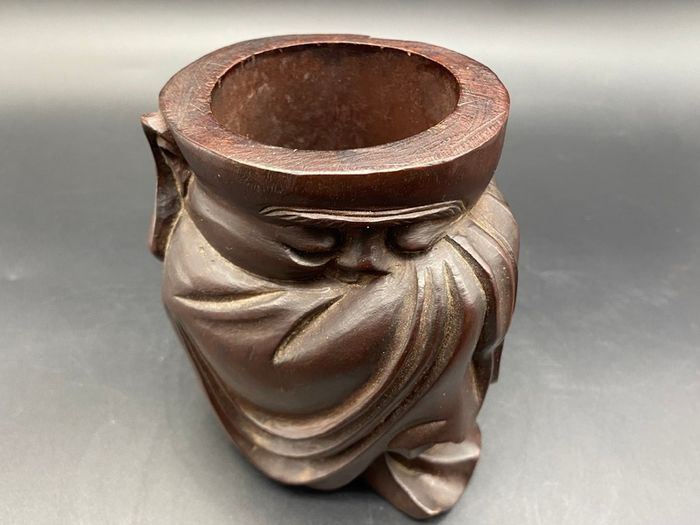 Chinese carved hardwood brush pot, carved with a Chinese Man