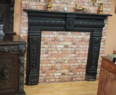 Ram-Head Wrought Iron Fireplace Surround with Timber Mantel