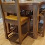 Solid wood oak extending dining table with matching chairs Image 8