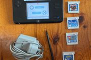 Nintendo 2DS with games and charger