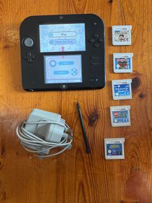 Nintendo 2DS with games and charger