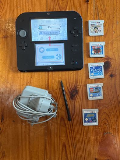 Nintendo 2DS with games and charger