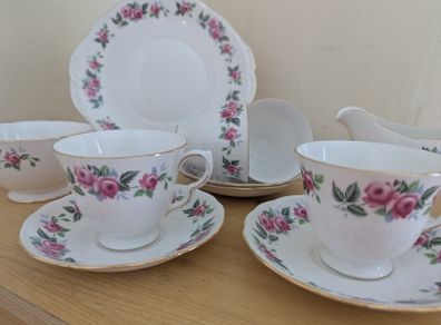 Queen Anne Bone China, tea set for 4 person, contains 11 pcs, including 4 tea cups, 4 saucers, a milk jar, a sugar bowl and a cookie serving plate 22cm. Impeccable conditions, looks like a new one, any scratches, cracks or cips.