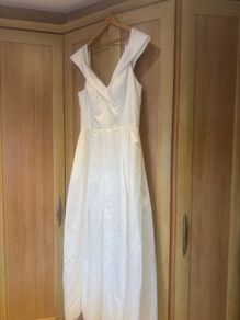 wedding dress and two bridesmaids dresses