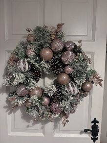 Stunning pink snow flocked wreath