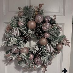 Stunning pink snow flocked wreath
