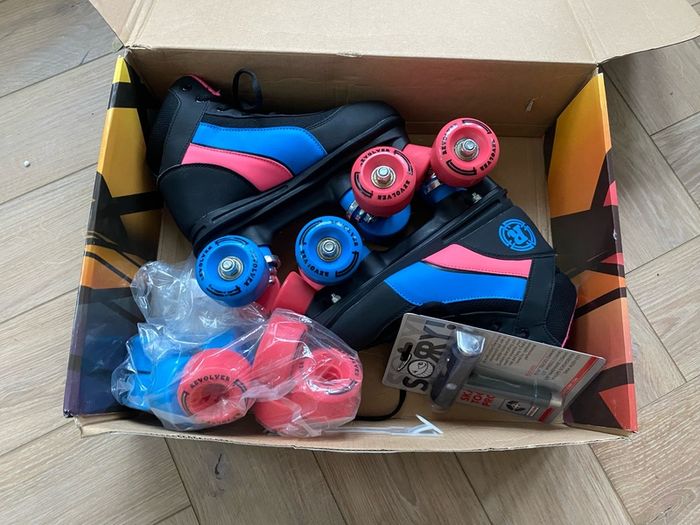 Children's Roller Skates size 4 with protective pads and box
