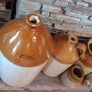 Collection of Eight Antique Stoneware Jars including Two Antique Hot Water Bottles Image 6